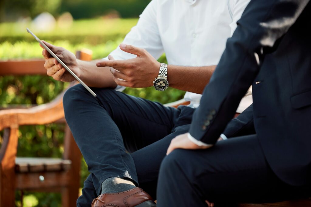 two businessmen having a meeting in the park
