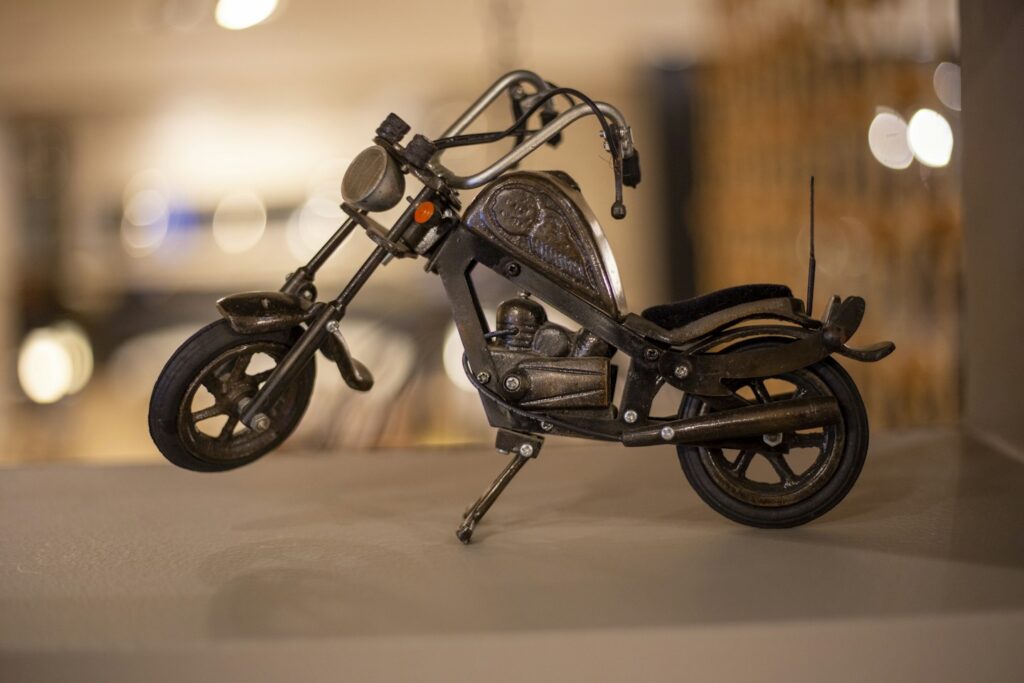 black motorcycle scale model on white table